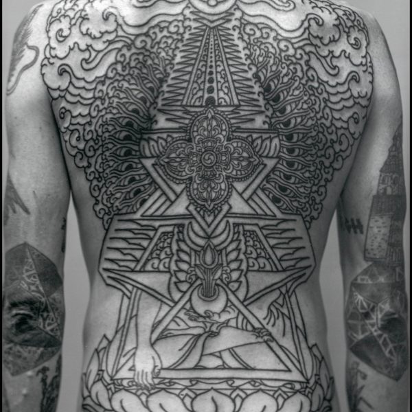 Complex blackwork tattoo by Thomas Hooper, featuring intricate geometric patterns and layered textures. Known for his abstract, meditative style, Thomas creates tattoos that blend organic and cosmic forms with precise linework and deep visual rhythm.