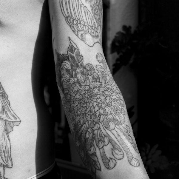 Complex blackwork tattoo by Thomas Hooper, featuring intricate geometric patterns and layered textures. Known for his abstract, meditative style, Thomas creates tattoos that blend organic and cosmic forms with precise linework and deep visual rhythm.