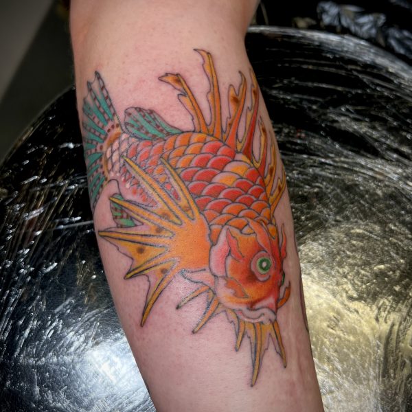 Traditional Japanese take on a Lionfish, in bright colours and fine lines. Tattooed by Harriet Street in Brighton.