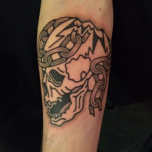 Hand-poked tattoo by Adam Sage, featuring smooth, precise linework and strong graphic composition. Inspired by brutalist architecture, children’s book illustration, and Soviet poster design, Adam creates timeless, non-electric tattoos with bold, simple forms.