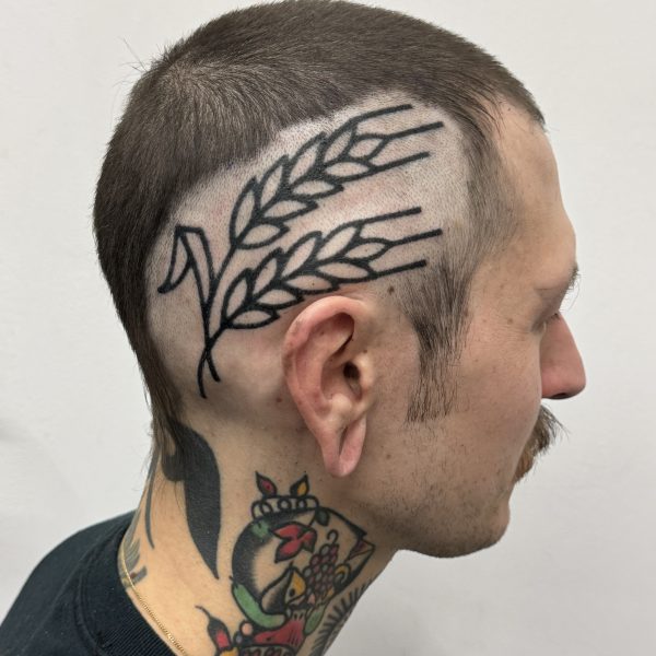 Hand-poked tattoo by Adam Sage, featuring smooth, precise linework and strong graphic composition. Inspired by brutalist architecture, children’s book illustration, and Soviet poster design, Adam creates timeless, non-electric tattoos with bold, simple forms.