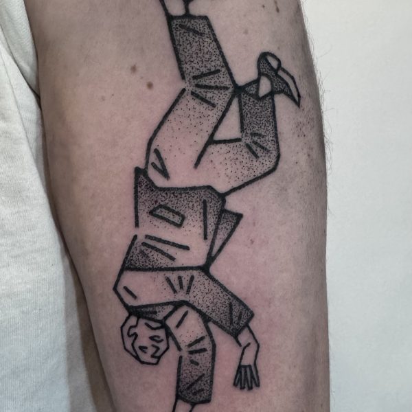 Hand-poked tattoo by Adam Sage, featuring smooth, precise linework and strong graphic composition. Inspired by brutalist architecture, children’s book illustration, and Soviet poster design, Adam creates timeless, non-electric tattoos with bold, simple forms.