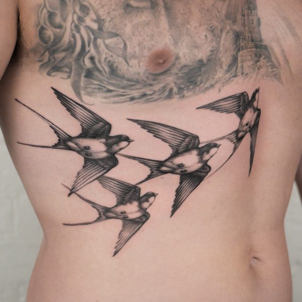 A group of realistic swallows tattooed by Alex Rufio. Alex is based in both Brighton, and London.