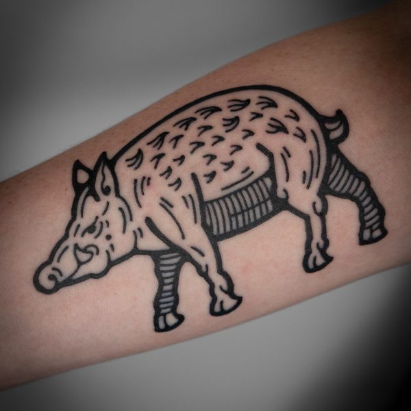 A playful pig tattoo with clean lines and textural detail by Mouse. Mouse creates tattoos inspired by medieval woodcuts, and fantasy scenes. Based in Brighton, at Nowhere Tattoo shop, Mouse illustrates an array of subjects, from animal, and gnomes, to swords and dragons.