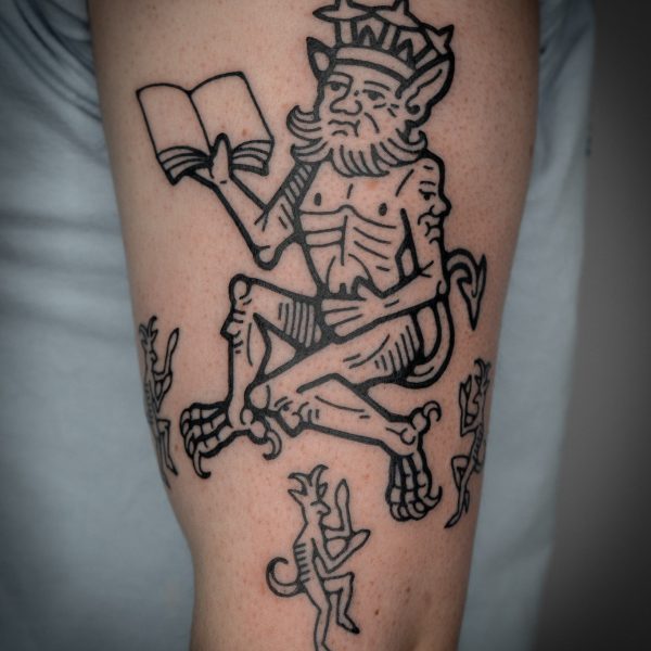 Intricate tattoo by Mouse, inspired by medieval woodcut illustration and folklore. The design features detailed, hand-drawn linework blending magical and mythical imagery with surreal and playful elements. Mouse works between London and Brighton, creating storytelling tattoos with bold, meticulous detail.