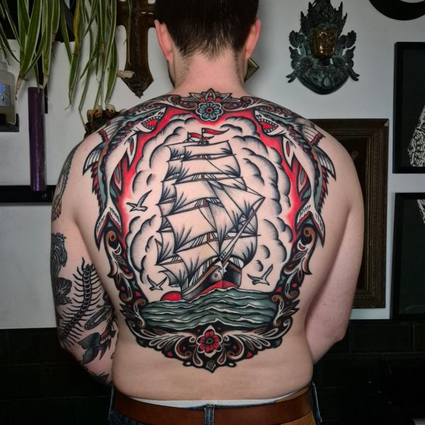 Traditional style back piece tattoo of a sailing ship by Edoardo Cucchelli. Edoardo is a specialist in Euro-Traditional Tattooing, and is always interested in hearing from new clients about their ideas or projects.