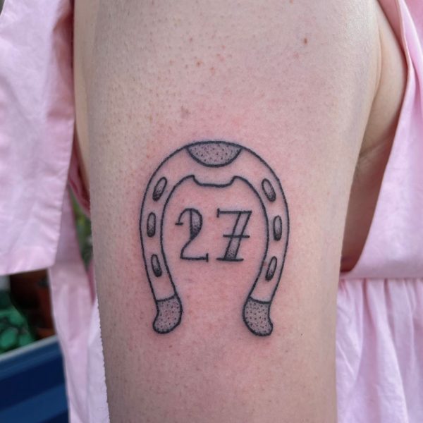 Cute horse shoe, cowboy themed tattoo by Rhianna I'Anson. Rhianna, originally from Brighton is now based at Nowhere Tattoo Shop, in the historic lanes area of Brighton City.