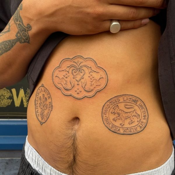 Handpoke tattoo by Rhianna I’Anson, featuring detailed, textural linework inspired by artefacts, stonework, and folklore. Rhianna works from Nowhere Tattooing in Brighton, blending traditional techniques with a timeless, organic style