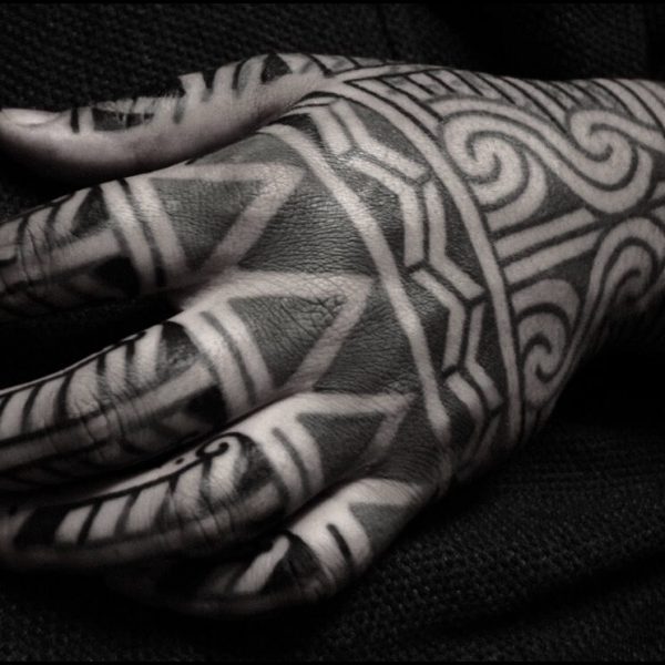 Bold blackwork tattoo by Francesco Capro, featuring strong ornamental patterns and timeless design. Francesco, originally from Northern Italy, works from Nowhere Tattooing in Brighton and Seven Doors Tattoo in London, bringing over thirteen years of experience and a passion for powerful, culturally rich tattoo art.