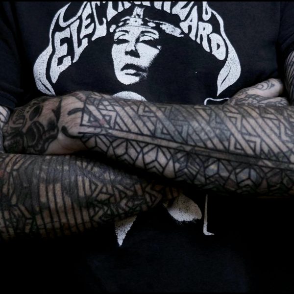 Bold blackwork tattoo by Francesco Capro, featuring strong ornamental patterns and timeless design. Francesco, originally from Northern Italy, works from Nowhere Tattooing in Brighton and Seven Doors Tattoo in London, bringing over thirteen years of experience and a passion for powerful, culturally rich tattoo art.