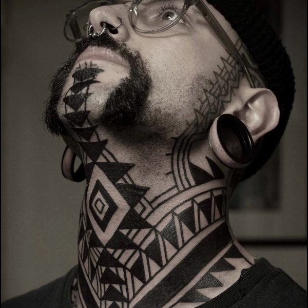 Bold blackwork tattoo by Francesco Capro, featuring strong ornamental patterns and timeless design. Francesco, originally from Northern Italy, works from Nowhere Tattooing in Brighton and Seven Doors Tattoo in London, bringing over thirteen years of experience and a passion for powerful, culturally rich tattoo art.