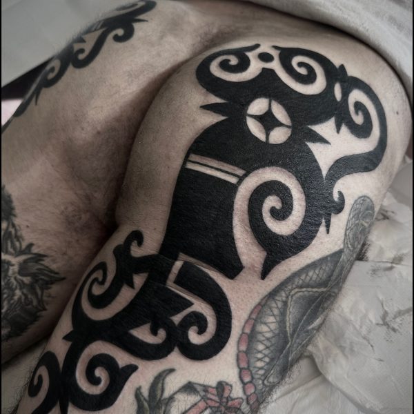 Bold blackwork tattoo by Francesco Capro, featuring strong ornamental patterns and timeless design. Francesco, originally from Northern Italy, works from Nowhere Tattooing in Brighton and Seven Doors Tattoo in London, bringing over thirteen years of experience and a passion for powerful, culturally rich tattoo art.